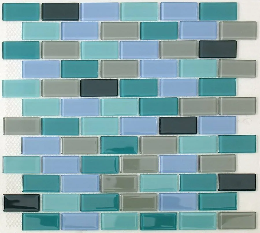 Repeating mosaic tile pattern in turquoise, teal, gray, and blue tones with white grout lines