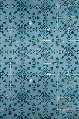 Repeating blue mosaic tile pattern with ornate damask and floral motifs