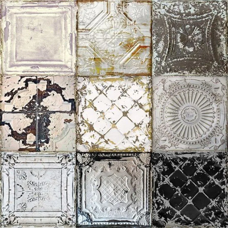 Grid of nine distressed decorative ceiling tiles with ornate patterns in cream, grey, and black with aged finishes.