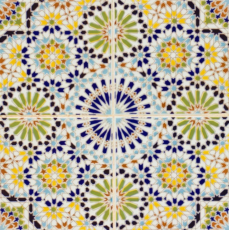 Symmetrical Moroccan mosaic tile pattern with blue starburst medallions, geometric lattice, and jewel-toned accents