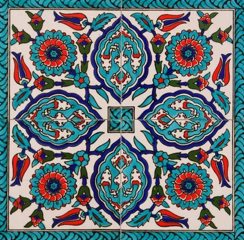 Symmetrical Islamic mosaic tile pattern with turquoise flowers, navy geometric shapes, and coral details on cream background.