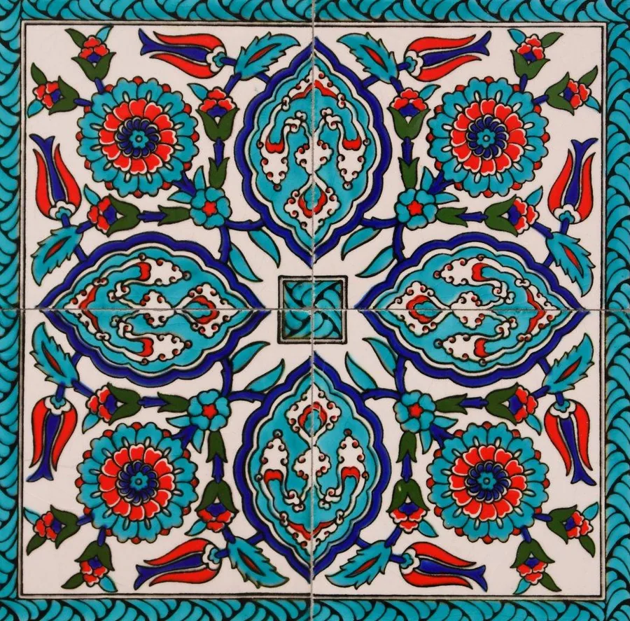 Symmetrical Islamic mosaic tile pattern with turquoise flowers, navy geometric shapes, and coral details on cream background.
