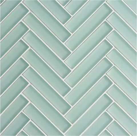 Repeating herringbone tile pattern in seafoam green with white grout lines creating geometric texture