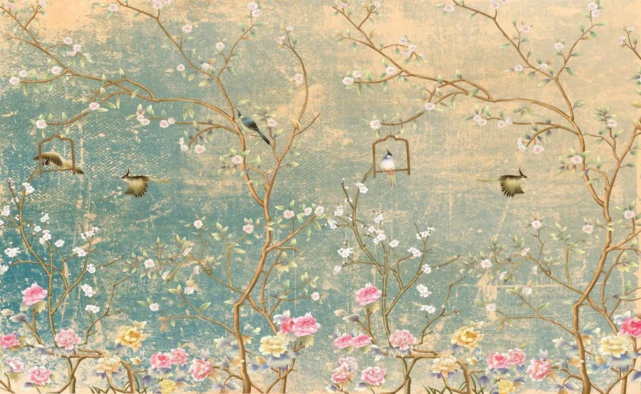 Vintage-style mural with white and pink blossoms on branches, birds, and decorative hanging cages on muted teal and cream background.