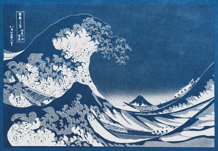 Blue and white Japanese woodblock-style wave pattern with Mount Fuji silhouette and swirling water details
