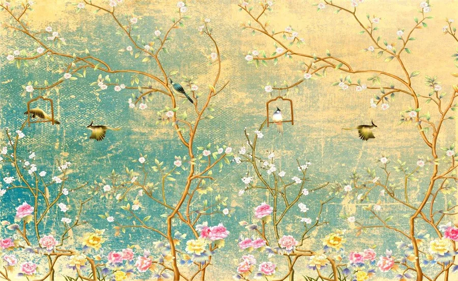 Vintage wallpaper mural with flowering branches, small birds, and hanging birdcages on aged turquoise and gold background.