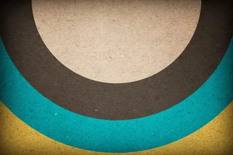 Layered semicircular arcs in cream, charcoal, teal, and mustard with textured finish