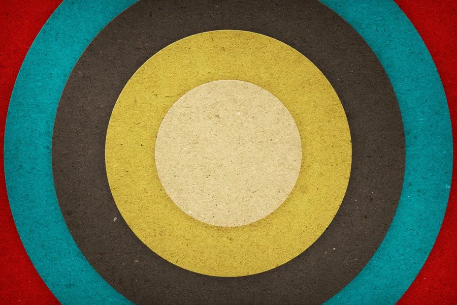 Concentric circles in cream, yellow, charcoal, teal, and red creating a retro bullseye pattern.
