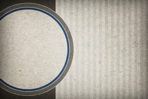 Geometric circle design with navy blue and grey rings on textured concrete background