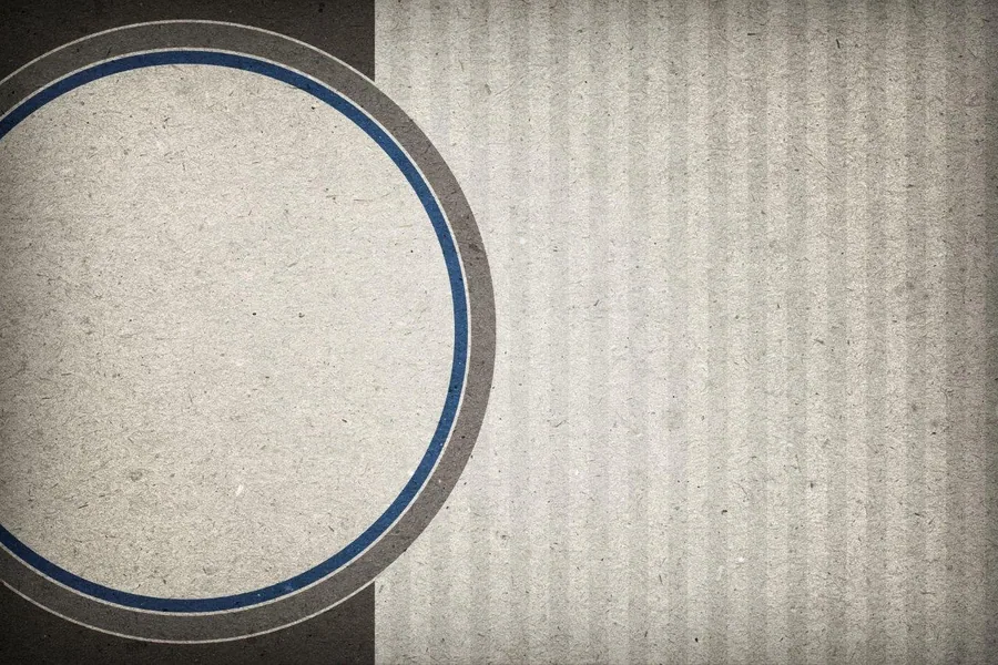Geometric circle design with navy blue and grey rings on textured concrete background