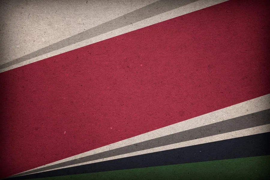 Abstract diagonal striped pattern with crimson, navy, and cream bands on textured background