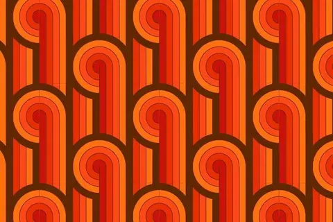 Repeating pattern of concentric orange spirals alternating with vertical red and orange stripes on a brown background.