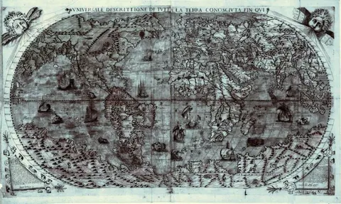 Vintage world map with ornamental details, compass roses, and sailing ships in sepia tones