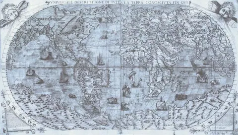 Vintage world map with sailing ships, continents, and decorative cartographic details in monochromatic blue-grey