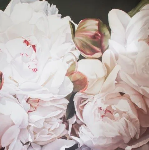 Close-up of white and pale pink peonies with layered petals and green stems on dark background.