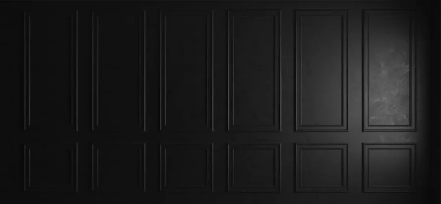Dark charcoal panelled wall texture with dimensional rectangular sections creating architectural depth