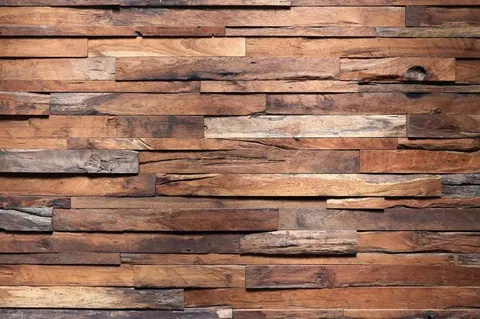 Close-up of staggered wooden planks in varying shades of brown with natural grain and knots.