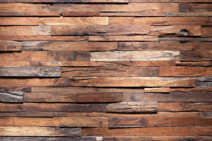 Close-up of staggered wooden planks in varying shades of brown with natural grain and knots.