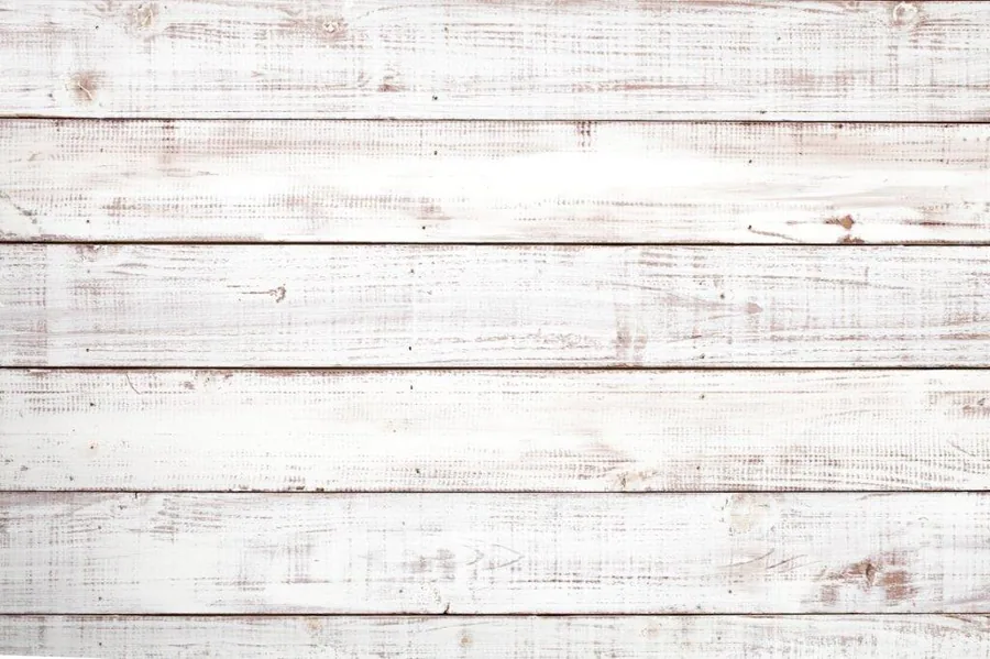 White weathered wood planks with natural grain texture and rustic distressing