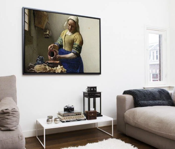 Floating framed canvas of The Milkmaid on a lounge wall